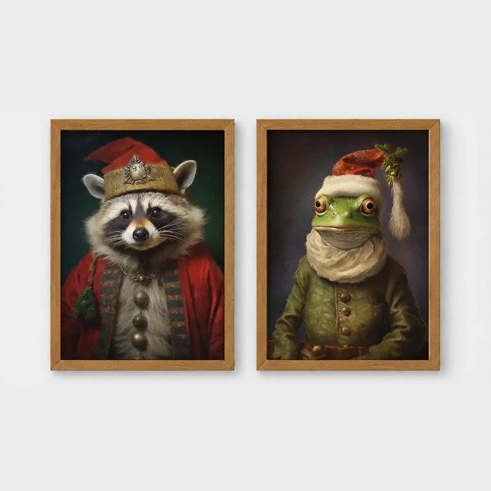 Set of 2 framed prints, animals in festive Christmas dress: a raccoon in a festive red robe and hat; and a frog in a green festive outfit with a Santa-style hat — unframed