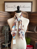 Wild Rag scarf with horses, lariats and horseshoes print on white in blue and orange