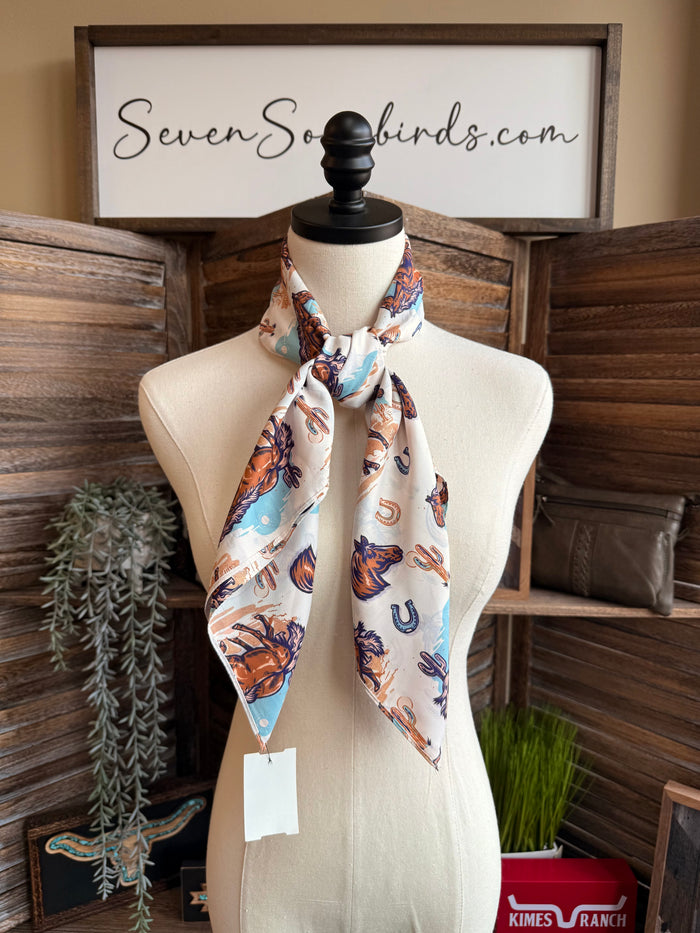 Wild Rag scarf with horses, lariats and horseshoes print on white in blue and orange