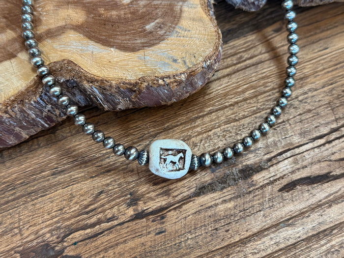 Close-up horse ceramic square pendant on silver-tone bead necklace chain