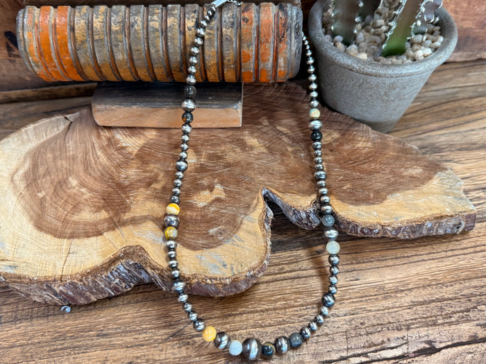 Beaded necklace with sterling silver chain and oval pearl-like jasper beads