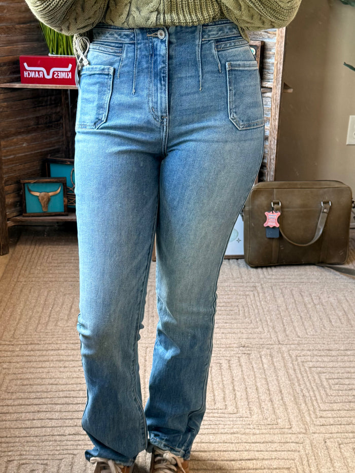 Women's light blue boot-cut jeans with patch pockets, belt loops and zipper fly