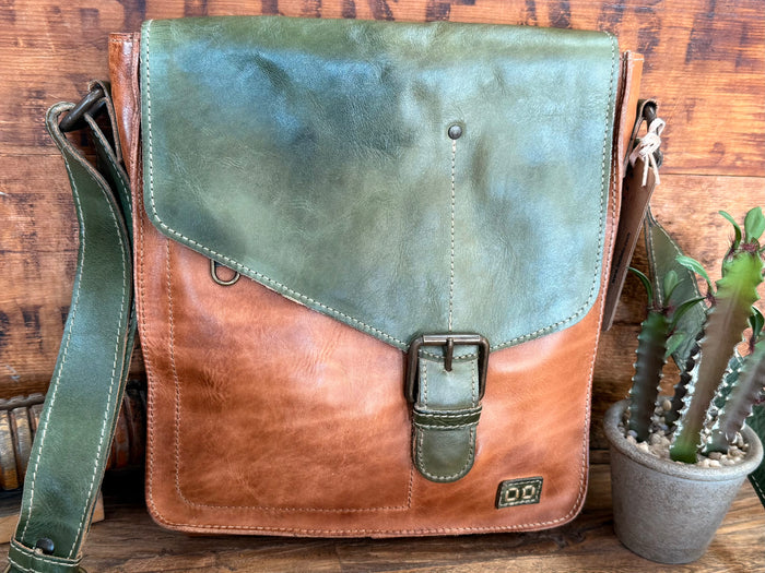Green and tan leather crossbody purse with flap closure, buckle strap, and front logo.