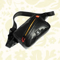 Forager Provisions LTD Artefact Eco black banana sling bag made from recycled lifeboat material with orange zip detail