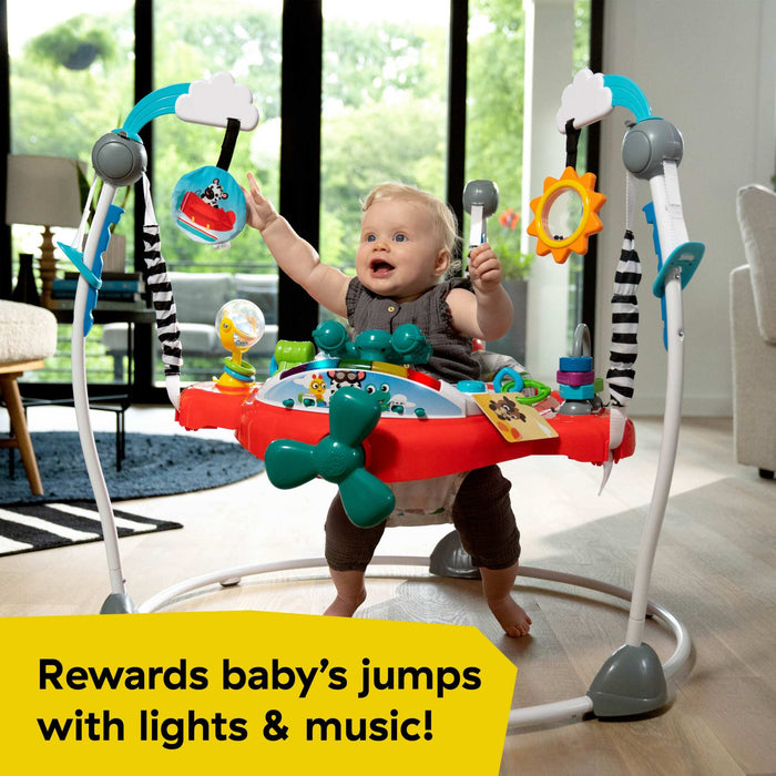 Baby using the Baby Einstein Airplane Adventure 2-in-1 Activity Jumper with music and lights.