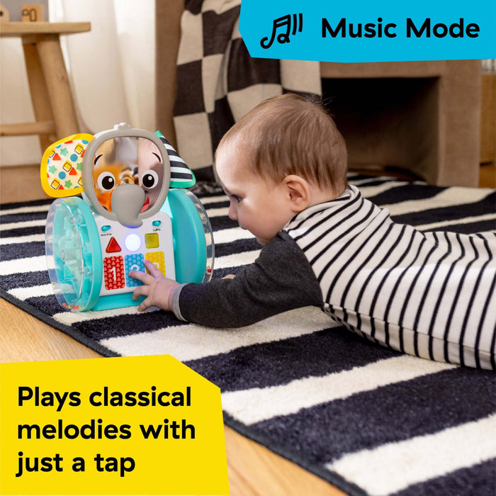Baby exploring Baby Einstein Chase & Tap Earl interactive crawling toy playing classical melodies