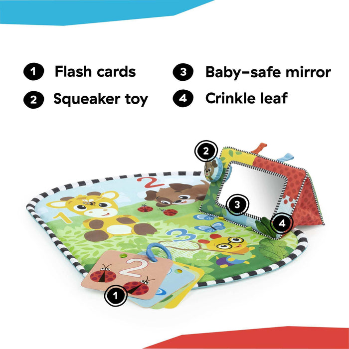 Foldable Baby Einstein Discovery Garden tummy time mat with mirror, toys, and colorful flashcards for infant play and learning.