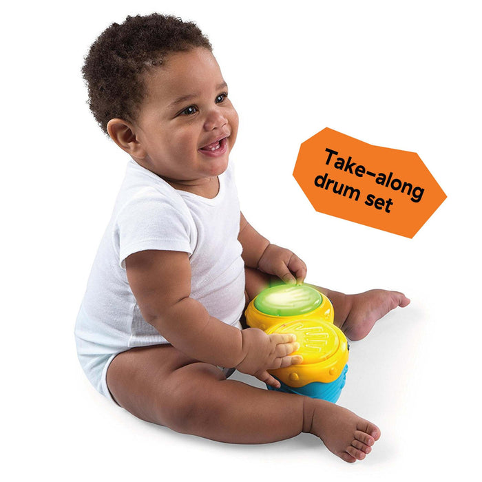 Baby with electronic bongo drums from Neighborhood Symphony Activity Jumper.