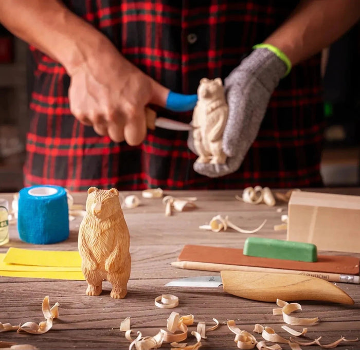 Forager Provisions LTD BeaverCraft DIY12 wood carving kit with a finished standing bear figure and whittling tools.