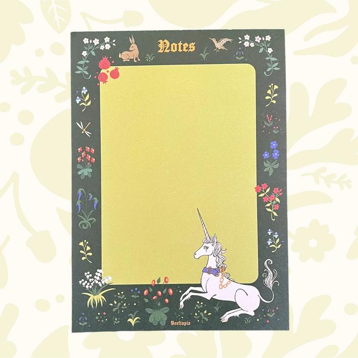 Beeftopia Unicorn Tapestry Notepad A6, “Notes,” floral border, cute rabbit, bird & unicorn art in bottom right corner.