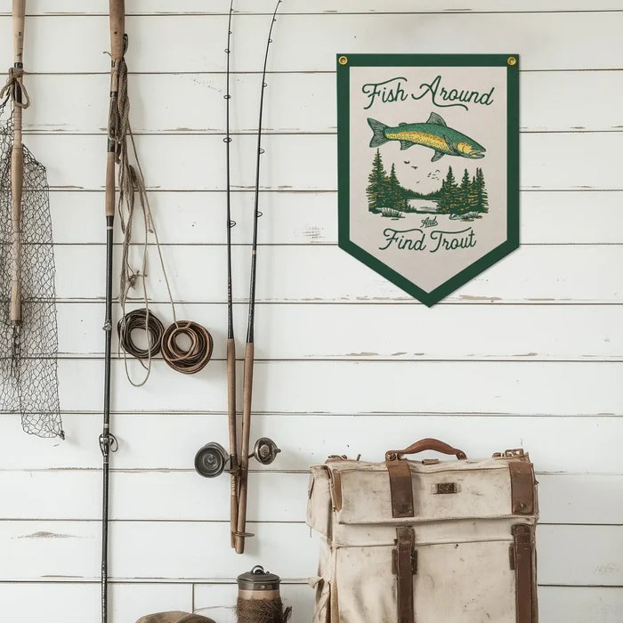 Fishing gear on white shiplap wall with Benoit Fish Around And Found Trout felt banner, perfect rustic fishing decor.