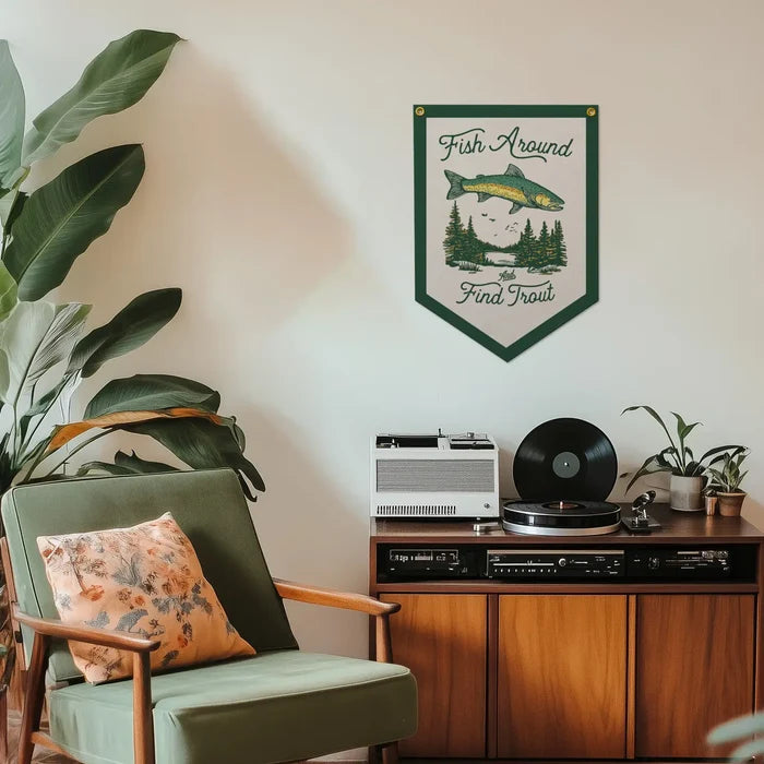 Mid-century modern room with green chair, vinyl record player, Benoit’s Fish Around And Found Trout Felt Banner decor.
