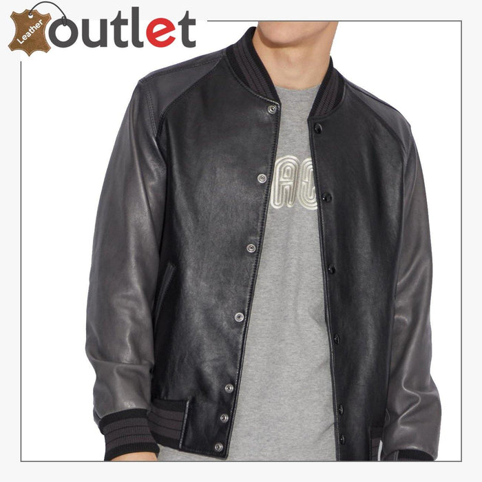 Side view of the black leather letterman jacket showing ribbed cuff and hem