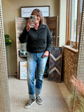 Dark quilted 1/4 zip sweatshirt with half-length zipper and stand collar