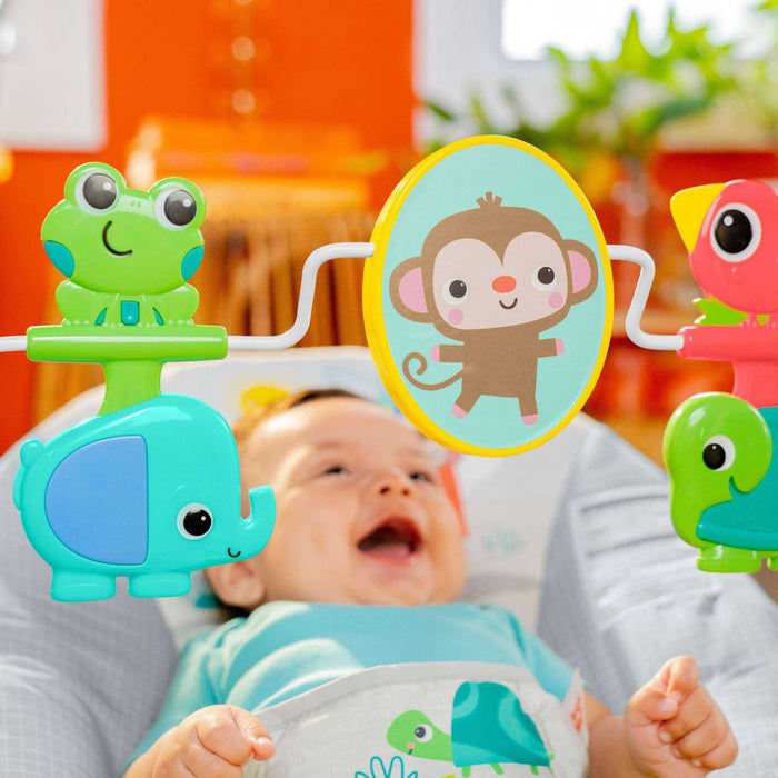 Bright Starts Playful Paradise vibrating baby bouncer with spinning toys and baby-safe mirror in a deep, comfortable seat