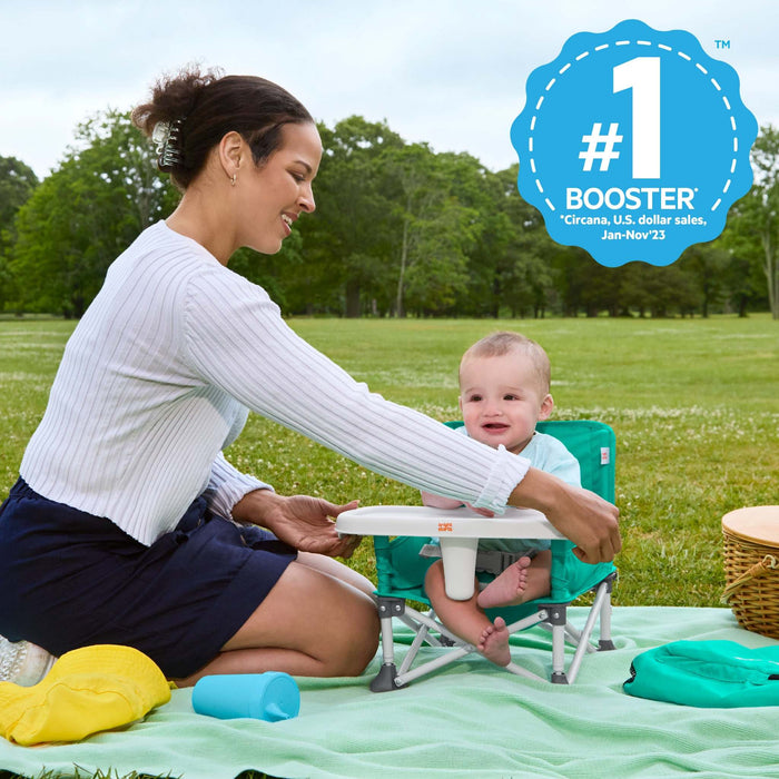 Bright Starts Pop ‘N Sit portable booster seat in teal with removable tray and carrying bag for babies and toddlers