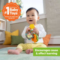 Baby playing with Bright Starts Safari Sounds Gift Set musical toys promoting cause and effect learning