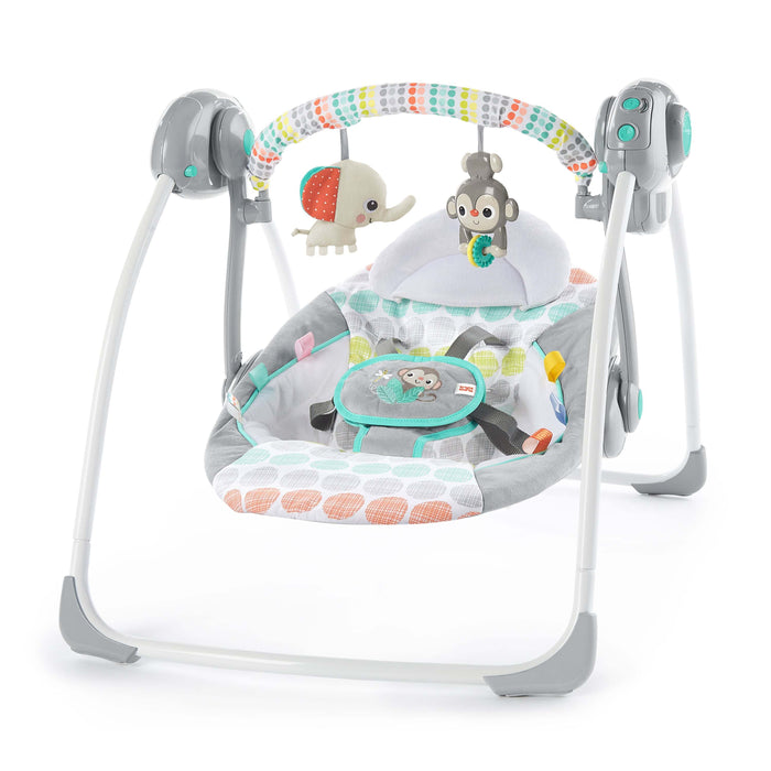 Bright Starts Whimsical Wild Portable Swing with elephant and monkey toys, colorful design, and adjustable seat.