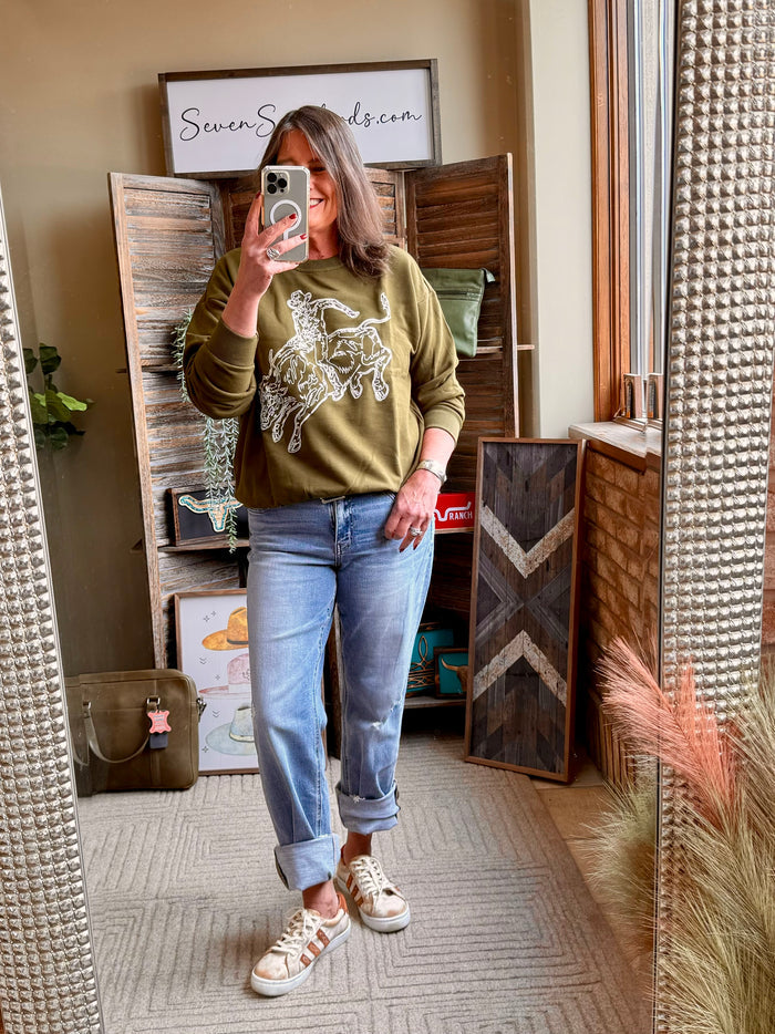 Olive embroidered crewneck sweatshirt with bull rider graphic; long sleeves