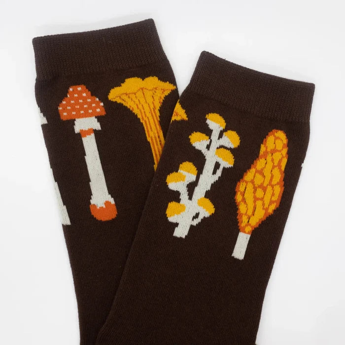 Camp Mustelid brown cotton socks, autumn mushroom pattern with orange, yellow & white fungi on a crisp white background. Cozy fall style.