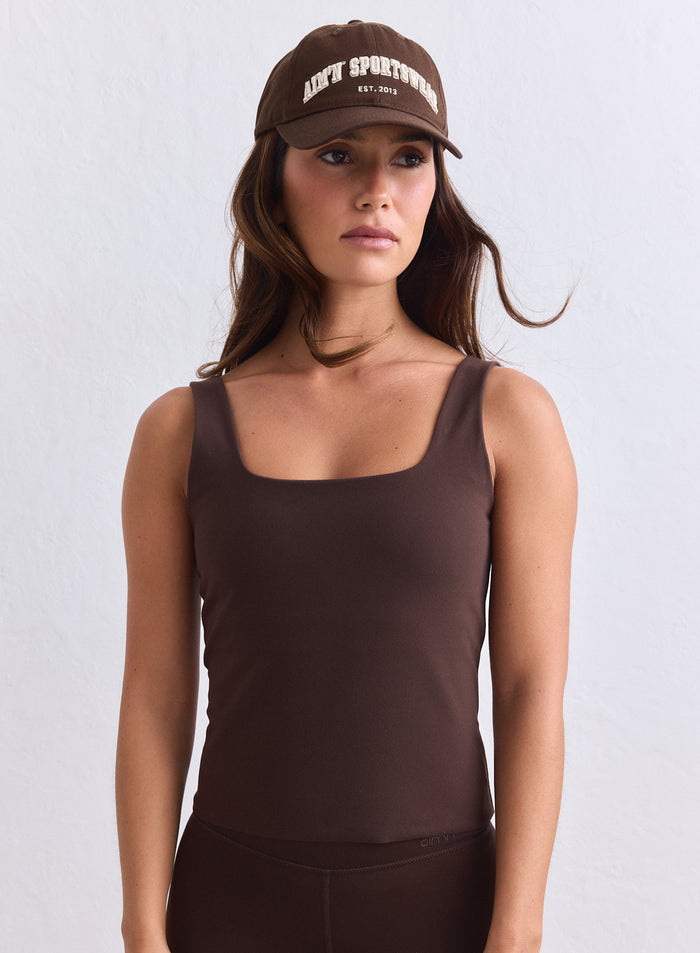 Suklaanruskea aim'n Sense Singlet neliöpääntiellä ja leveillä olkaimilla, second skin -tuntuma. [s-165cm]