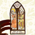 Forager Provisions LTD Clarice Tudor medieval stained glass window sticker with humorous text held against the sky.