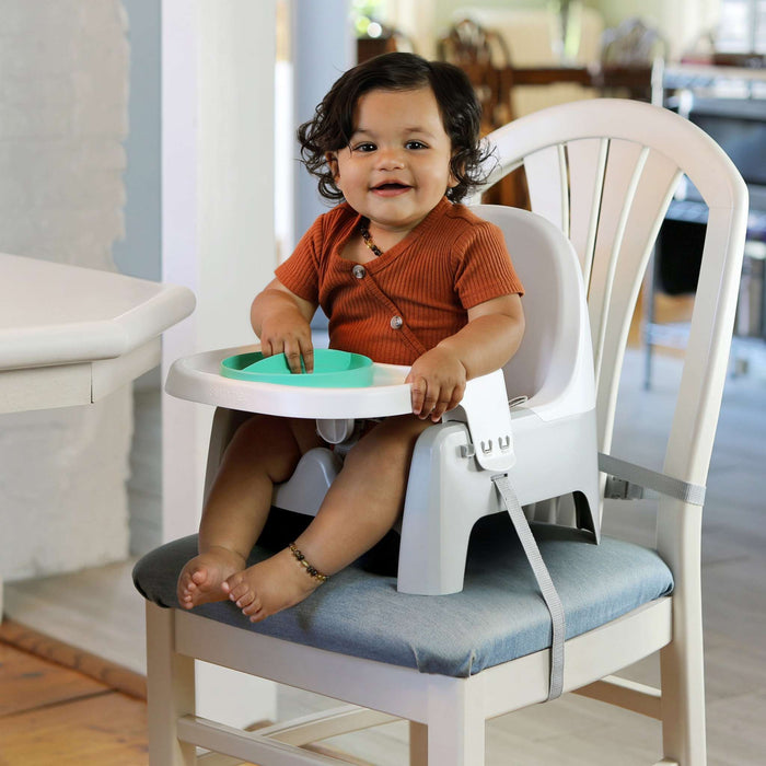Ingenuity Deluxe Learn-to-Dine Feeding Seat with lock-in Twist & Dine trays and 3-point harness for secure infant and toddler mealtime seating