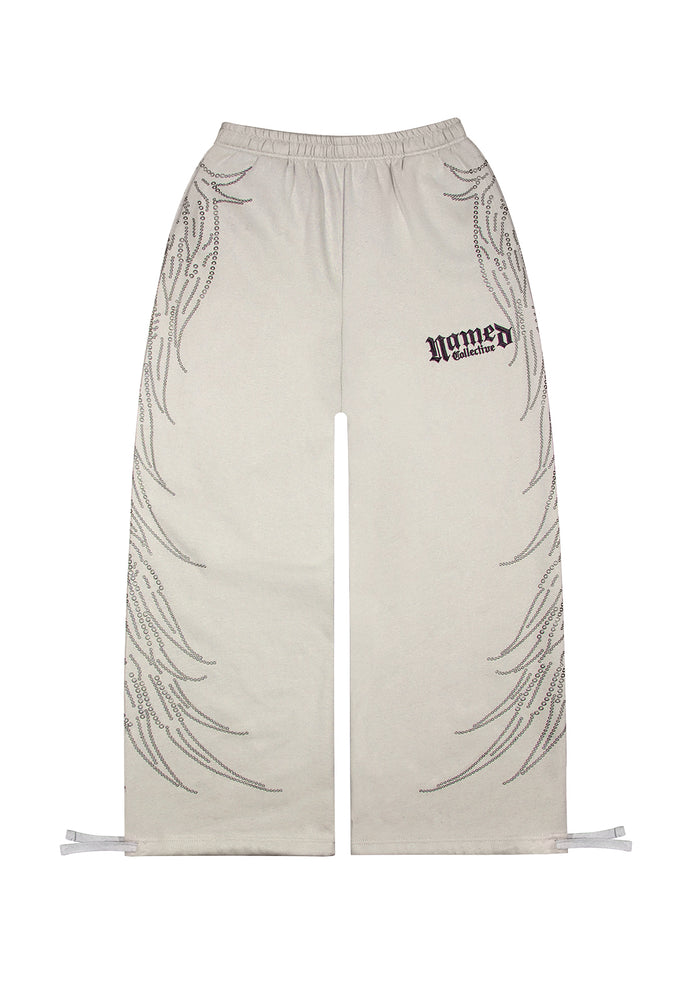 Front view of bone sweatpants featuring studs and logo embroidery.