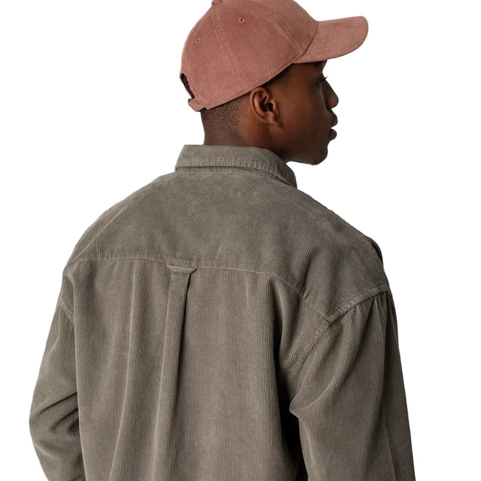 Man in taupe shirt models Forager Provisions Redwood Cord Baseball Cap with patch on white background; trendy hat fashion style.