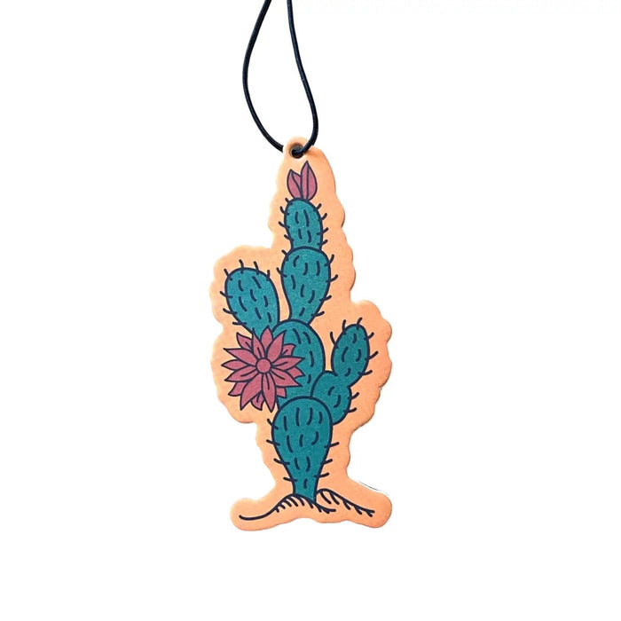 Introducing the Good & Well Supply Co Hangable Air Freshener - Zion, featuring a cactus design and packaging with an orange header card. Enjoy the refreshing aroma of desert lavender while knowing that a portion of proceeds supports the National Park Foundation.