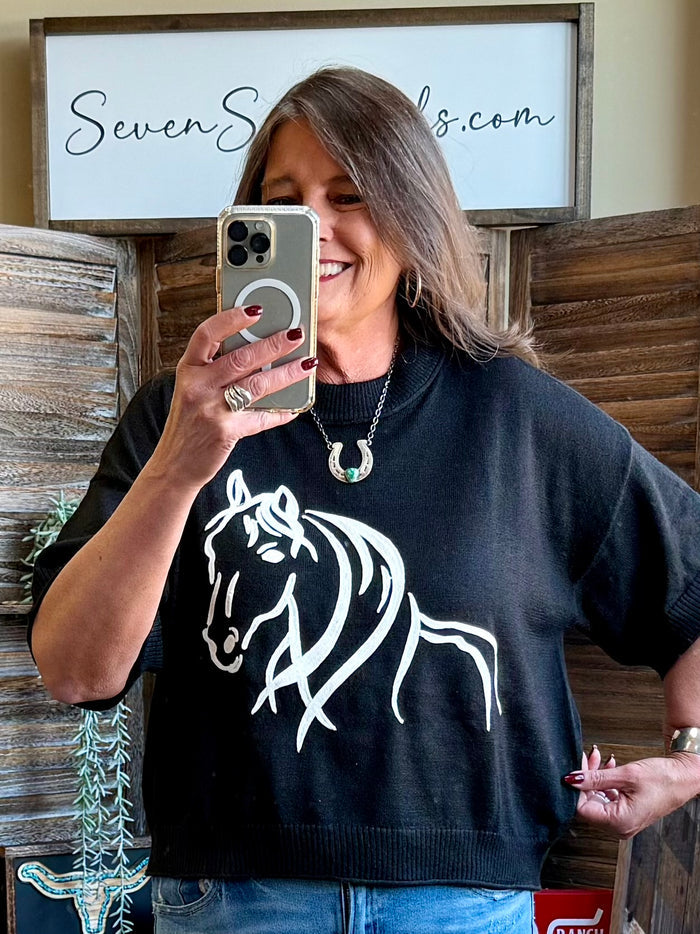 Black 3/4 sleeve sweater with white horse graphic and ribbed hem