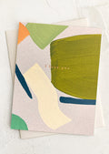 Greeting card with abstract shapes and 'I love you' text on a white background