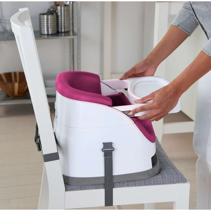 Pink Flambe Ingenuity Baby Base 2-in-1 Booster Seat attached to dining chair with removable tray