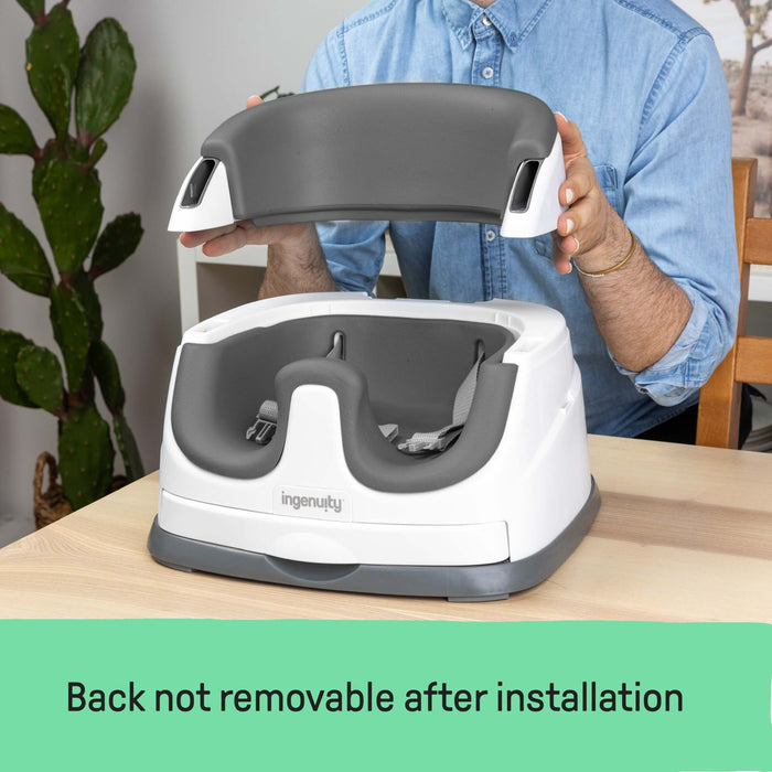 Ingenuity Baby Base 2-in-1™ Seat in Slate attached to a dining chair with removable tray for baby feeding and toddler use
