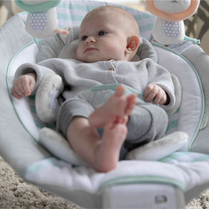Ingenuity Bouncer Landry the Lion infant seat with plush fabric, vibrations, melodies, removable toy bar, and cushioned support