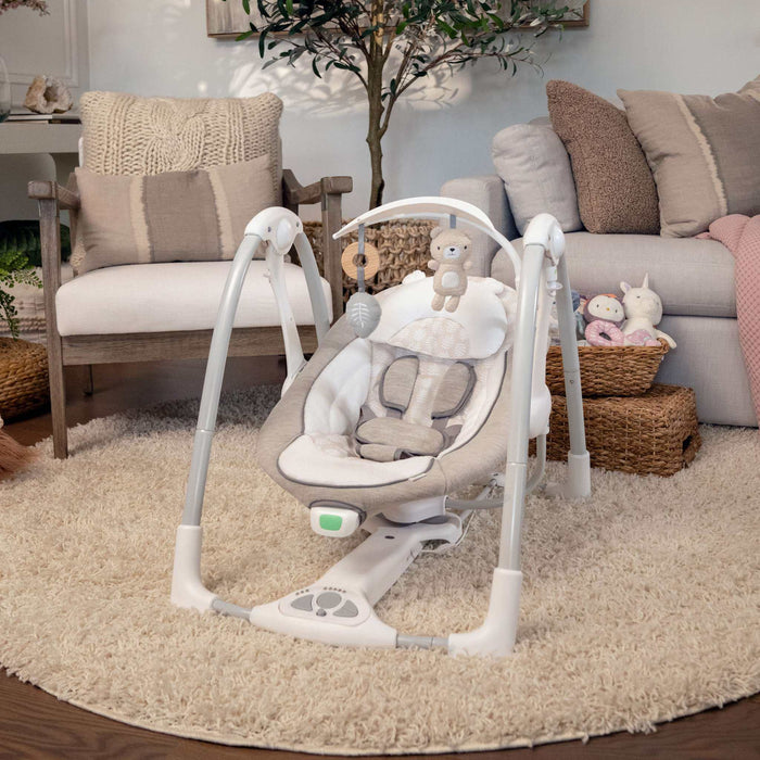 Ingenuity ConvertMe Swing-2-Seat Wynn baby swing with plush seat, toy bar, and EasyLock convertible swing-to-seat design