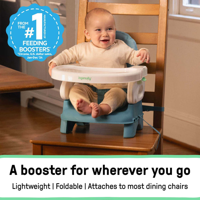 Teal Ingenuity Deluxe Comfort folding baby booster seat with adjustable height and removable tray