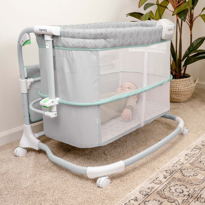 Ingenuity Dream & Grow Bedside Bassinet with breathable mesh sides and adjustable height for newborn comfort