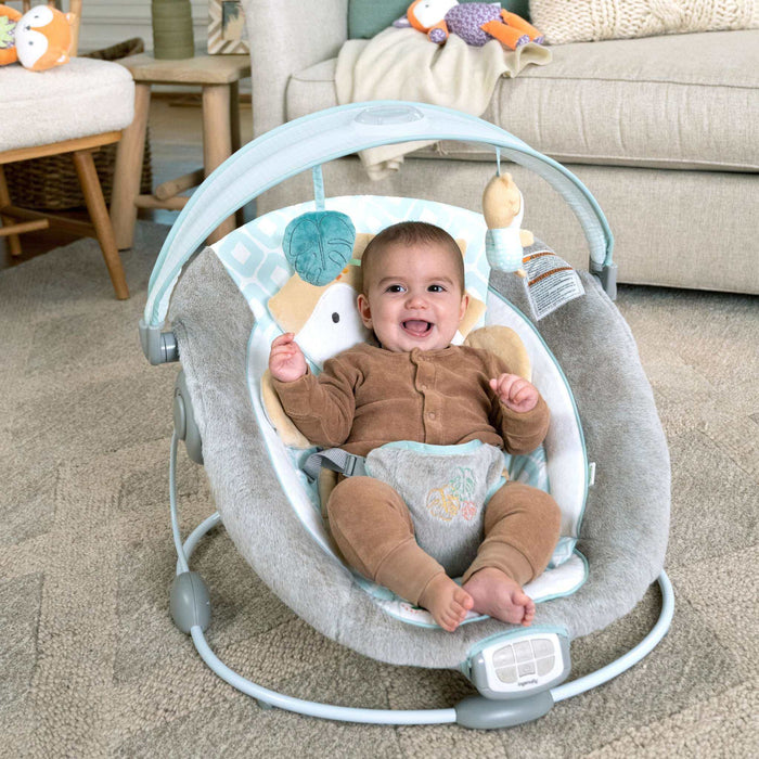 Ingenuity InLighten baby bouncer seat with light-up toy bar and cozy fox bolster