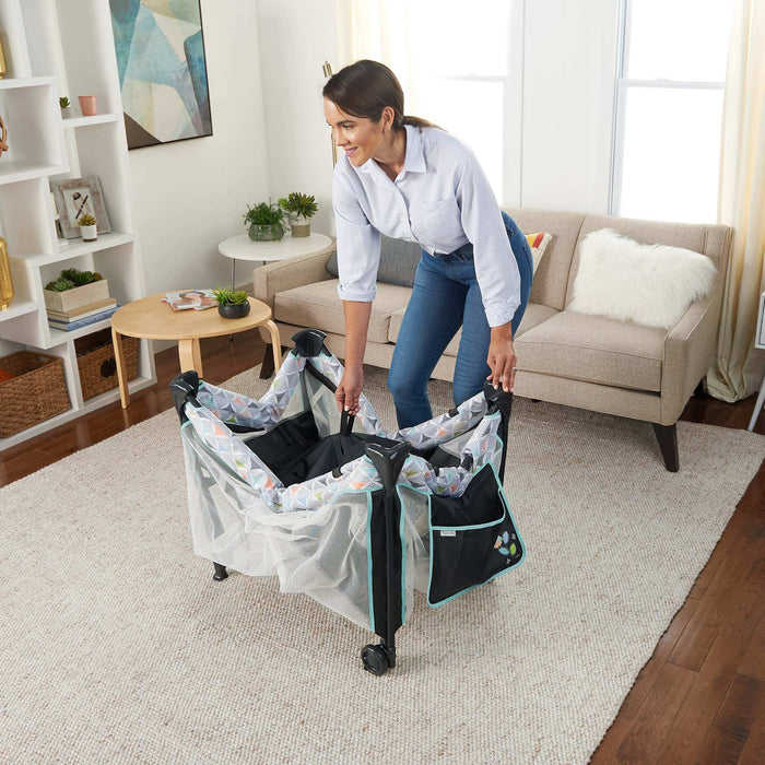 Ingenuity Bryant smart simple travel cot with bassinet and changing table
