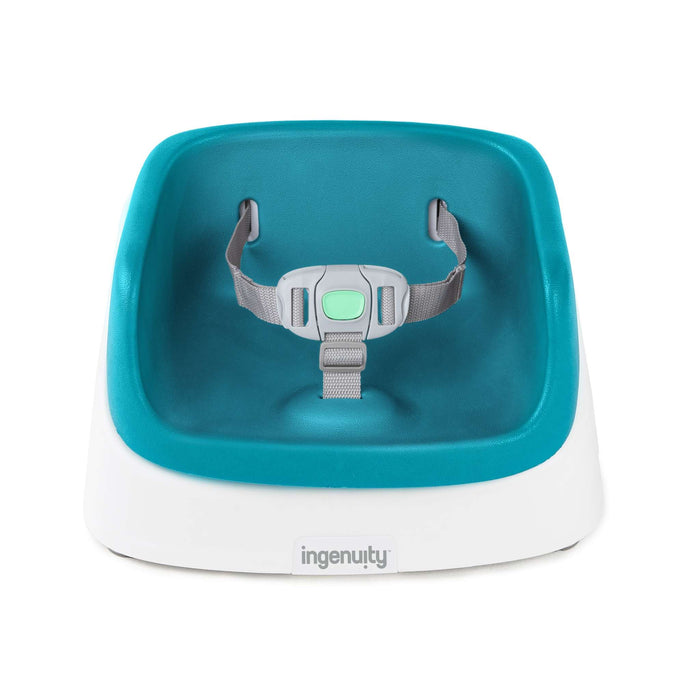 Ingenuity SmartClean Toddler Booster Seat in peacock blue with removable foam insert and 3-point harness attached to dining chair