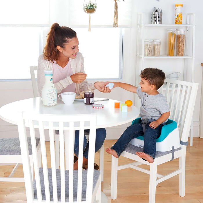 Ingenuity SmartClean toddler booster seat in peacock blue with removable foam insert and 3-point harness