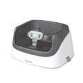Ingenuity SmartClean toddler booster seat in slate color with removable foam insert and 3-point harness strapped to a dining chair