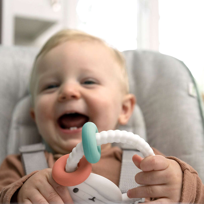 Ingenuity Soothing Sheppy baby teether toy made of BPA-free silicone with smooth texture and activity rings, gender-neutral design