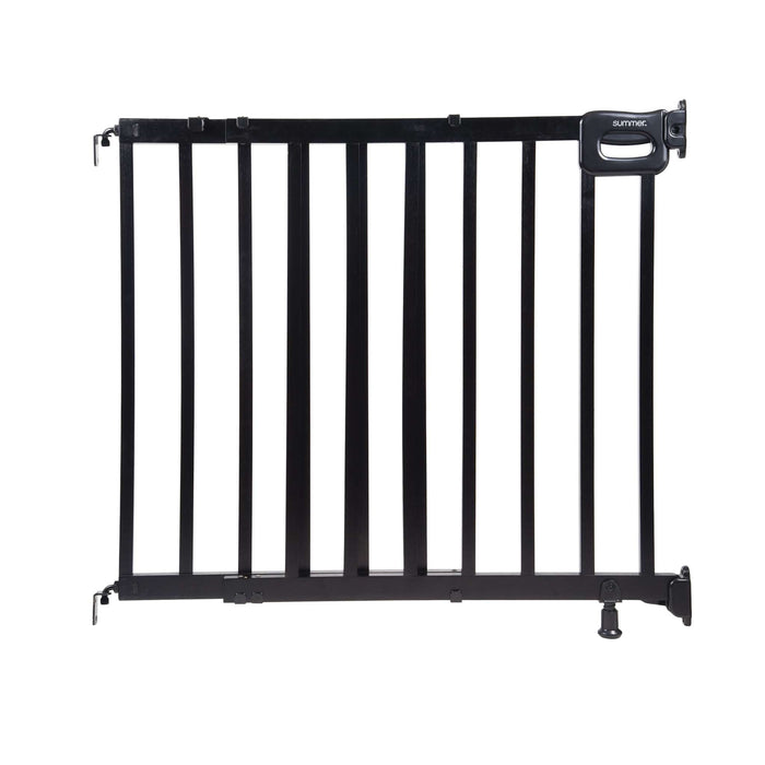 Ingenuity The Stairway 48W Series black wooden baby and pet safety gate installed in a home stairway