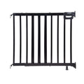 Ingenuity The Stairway 48W Series black wooden baby and pet safety gate installed in a home stairway