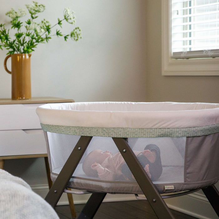 Ingenuity Wood FoldAway Rocking Bassinet with breathable fabric and foldable wooden frame