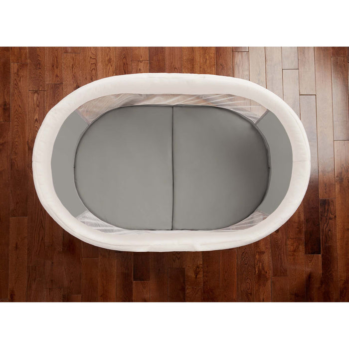 Ingenuity Wood FoldAway Rocking Bassinet in neutral fabric with foldable wooden frame and breathable design