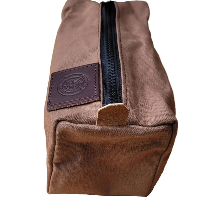 Forager Provisions LTD Journeyman Craft brown waxed canvas camping peg case with a black YKK zipper and leather patch.