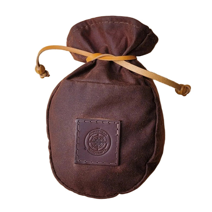 Forager Provisions LTD Journeyman Craft chestnut brown waxed canvas coffee pouch with a leather tie closure.